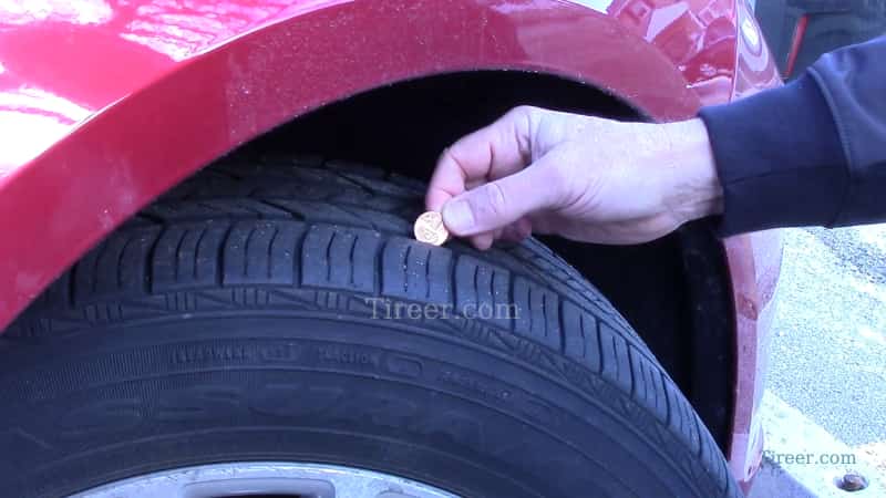 Check-tire-tread-depth-with-a-penny
